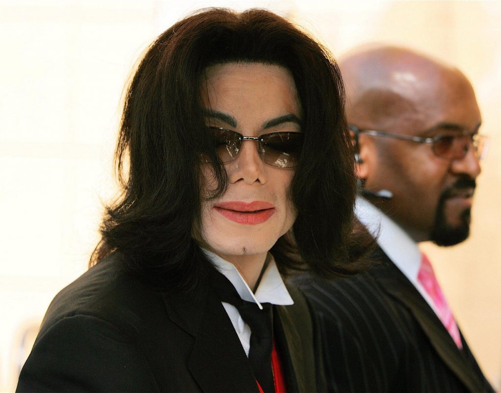 MICHAEL JACKSON arriving at lawyer Johnnie L Cochran's funeral at West Angeles Cathedral