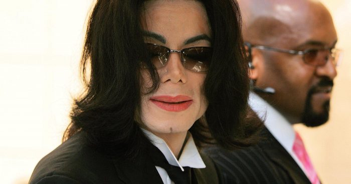 MICHAEL JACKSON arriving at lawyer Johnnie L Cochran's funeral at West Angeles Cathedral