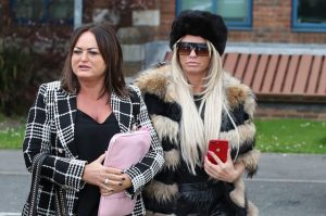 Price, right, clutched her phone before and during the court appearance (Steve Parsons/PA)