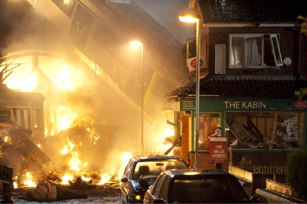 Editorial use only. Exclusive - Premium Rates Apply. Call your Account Manager for pricing. Mandatory Credit: Photo by ITV/REX/Shutterstock (1278399ci) TRAM CRASH The Street resident look on in horror as the smoke dies down. 'Coronation Street' TV Programme. - 2010