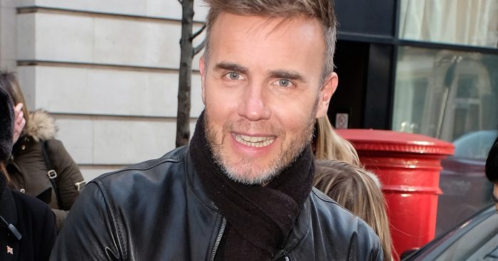 Gary Barlow greets fans as he leaves BBC Radio 2 in London
