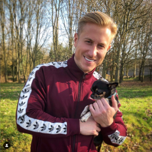 Kris Boyson with a dog revealing anxiety battle