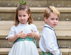 Prince George and Princess Charlotte on steps at wedding