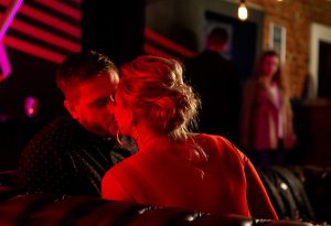Tracy and David kiss