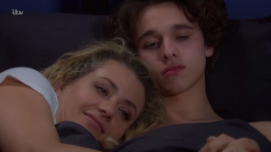 Maya and Jacob cuddling in Emmerdale