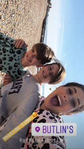 Stacey and her sons on the beach