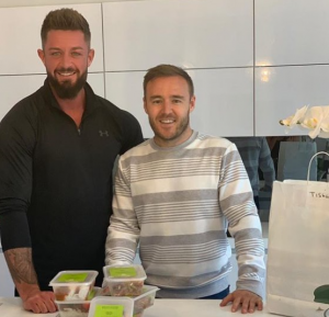 Alan poses with his meal prep