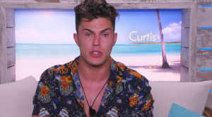 Curtis has already found himself in an "exclusive" relationship in the villa (Credit: ITV)