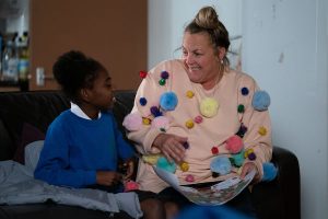 Karen tries to help Bailey with a school project EastEnders