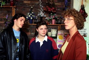 Editorial use only. Exclusive - Premium Rates Apply. Call your Account Manager for pricing. Mandatory Credit: Photo by ITV/Shutterstock (669486ow) Coronation Street: - 1993 Deirdre goes to the florist to look for Tracy but gets quite a shock when she finally finds out who Tracy is now living with. L-R Craig Lee [Kieran O'Brien], Tracy Barlow [Dawn Acton] and Deirdre Barlow [Anne Kirkbride]. ITV ARCHIVE