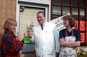 Editorial use only. Exclusive - aPremium Rates Apply. Call your Account Manager for pricing. Mandatory Credit: Photo by ITV/Shutterstock (669486pc) Coronation Street: TV - 1993 Alf Roberts [Bryan Mosley] proudly opens the mini market again. Sally Webster [Sally Whittaker] and Deirdre Barlow [Anne Kirkbride] look on. ITV ARCHIVE