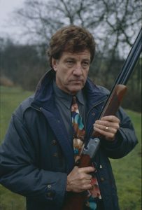 Editorial use only Mandatory Credit: Photo by ITV/Shutterstock (8067069i) Norman Bowler (as Frank Tate) as Frank threatens Pollard with a gun (Ep 1752 - 1st April 1993) 'Emmerdale' TV Series - 01 Apr 1993 Emmerdale Farm is a long-running British soap opera set in Emmerdale, a fictional village in the Yorkshire Dales. Created by Kevin Laffan, it first broadcast on 16 October 1972 and produced by ITV Yorkshire.