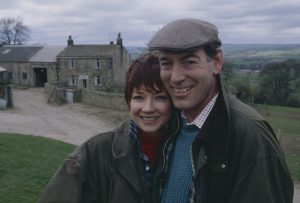 Editorial use only Mandatory Credit: Photo by ITV/Shutterstock (8105575m) Madeleine Howard (as Sarah Connolly) and Clive Hornby (as Jack Sugden) as the Sugdens move into Hawthorn Cottage farm (Ep 1758 - 22nd April 1993) 'Emmerdale' TV Series - - 22 Apr 1993 Emmerdale Farm is a long-running British soap opera set in Emmerdale, a fictional village in the Yorkshire Dales. Created by Kevin Laffan, it first broadcast on 16 October 1972 and produced by ITV Yorkshire.