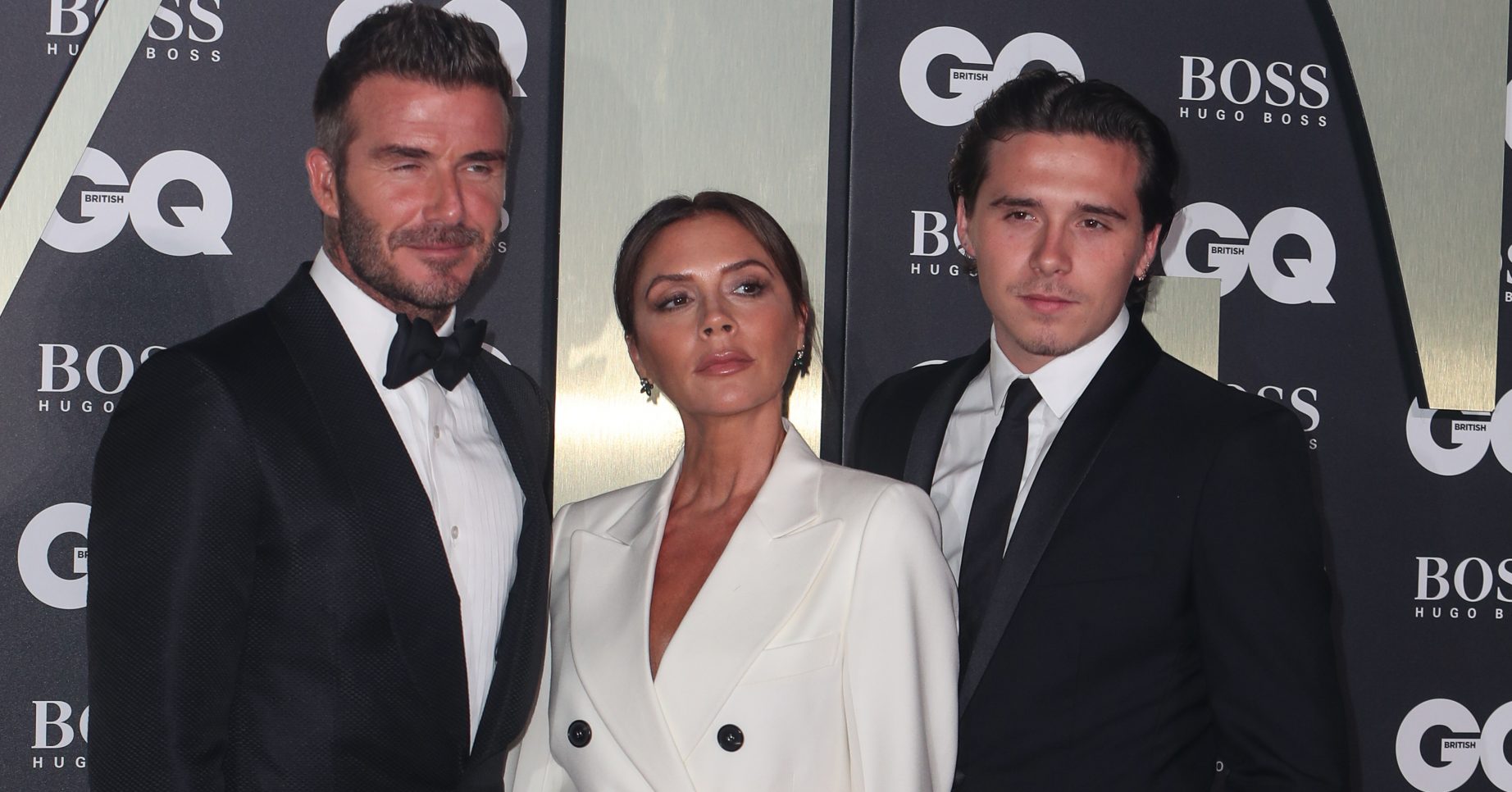 David, Victoria and Brooklyn Beckham attend the GQ Men of the Year Awards in association with Hugo Boss at the Tate Modern in London Pictured: David Beckham,Victoria Beckham,Brooklyn Beckham Ref: SPL5112873 040919 NON-EXCLUSIVE Picture by: SplashNews.com Splash News and Pictures Los Angeles: 310-821-2666 New York: 212-619-2666 London: +44 (0)20 7644 7656 Berlin: +49 175 3764 166 photodesk@splashnews.com World Rights
