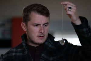 Ben finds Sharon's necklace at the Branning house (Credit: BBC)