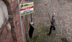 Robert smashes up the 'sale' sign on the Bistro Coronation Street