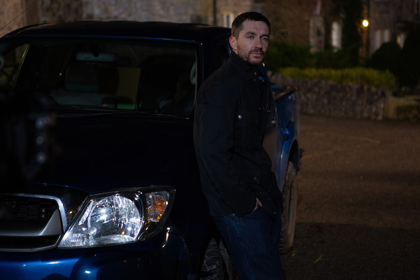 Pete Barton leans on his car as he prepares to leave Emmerdale