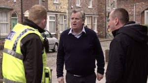 FROM ITV STRICT EMBARGO - No Use Before Tuesday 25th February 2020 Coronation Street - Ep 10024 Friday 6th March 2020 - 1st Ep Brian Packham [PETER GUNN] hotfoots it from the Kabin after a shoplifter. Craig Tinker [COLSON SMITH] gives chase but soon finds himself out of breath and gives up.
