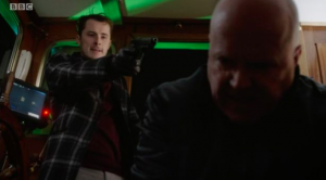 Ben points gun at Phil