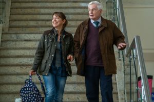 Gillian and Alan excitedly greeted Ted at the airport - but they were in for a surprise (Credit: BBC)