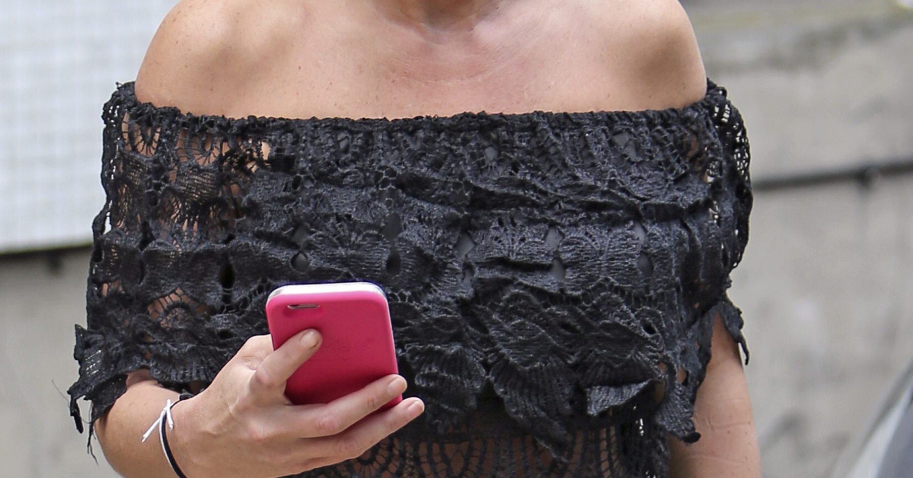 Dannielle Westbrook smiles as she poses in a strapless top