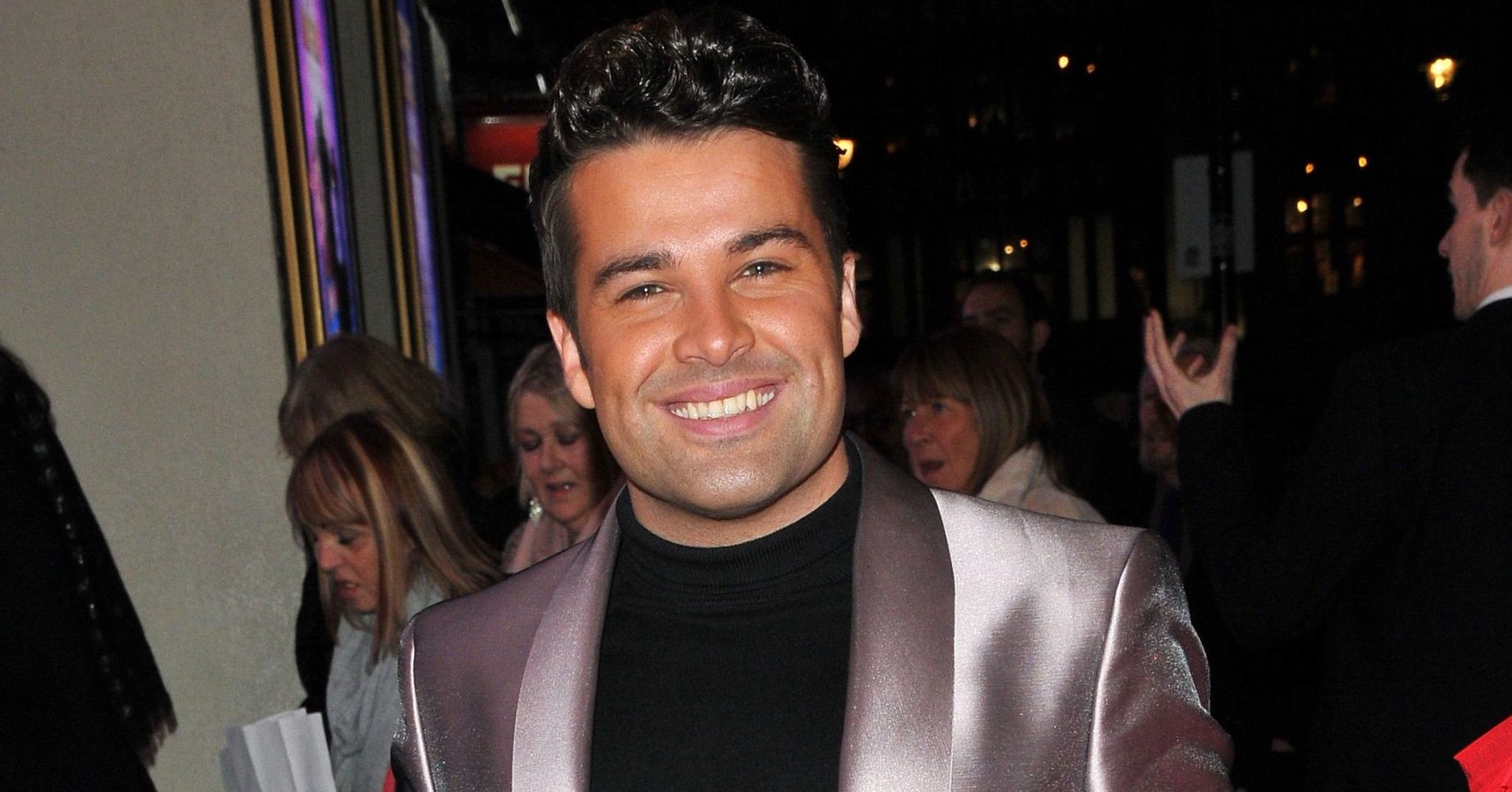 Joe McElderry smiles in red carpet photo