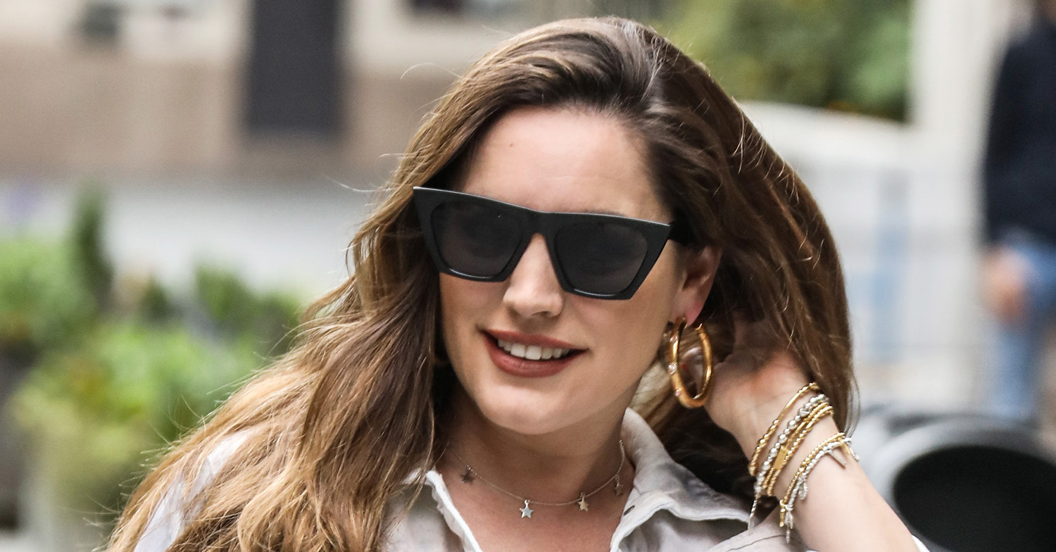 Kelly Brook in dark shades flicking her hair