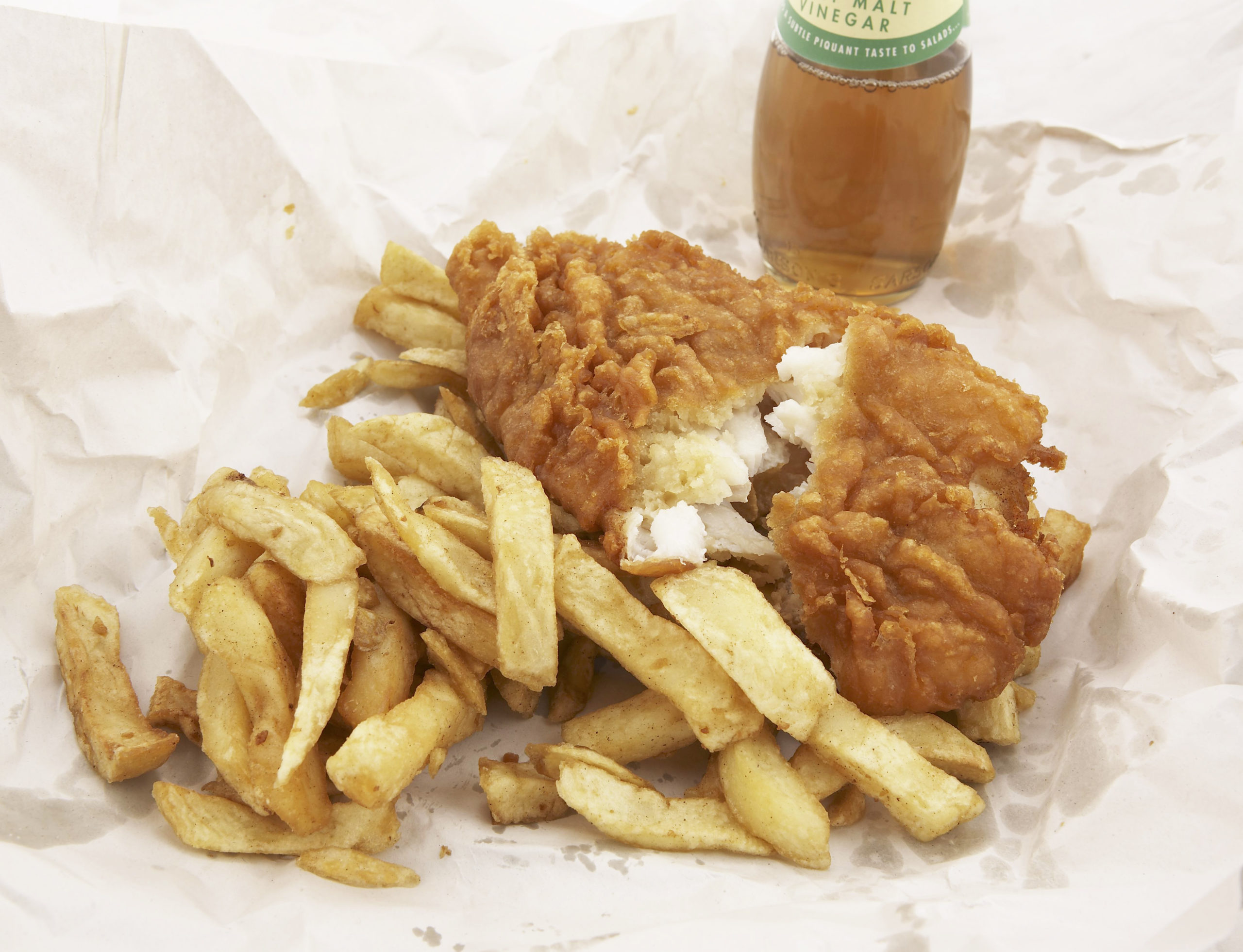 traditional fish and chips in paper from a chip shop