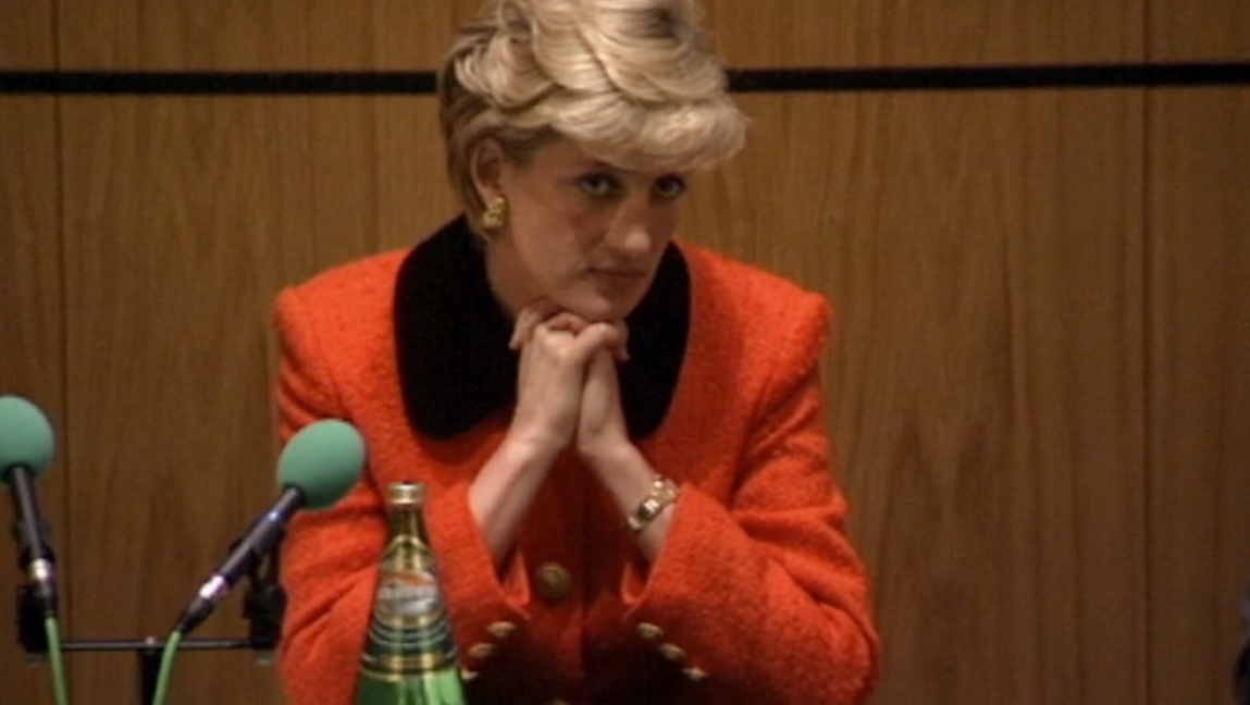 Princess Diana clasping hands under her face