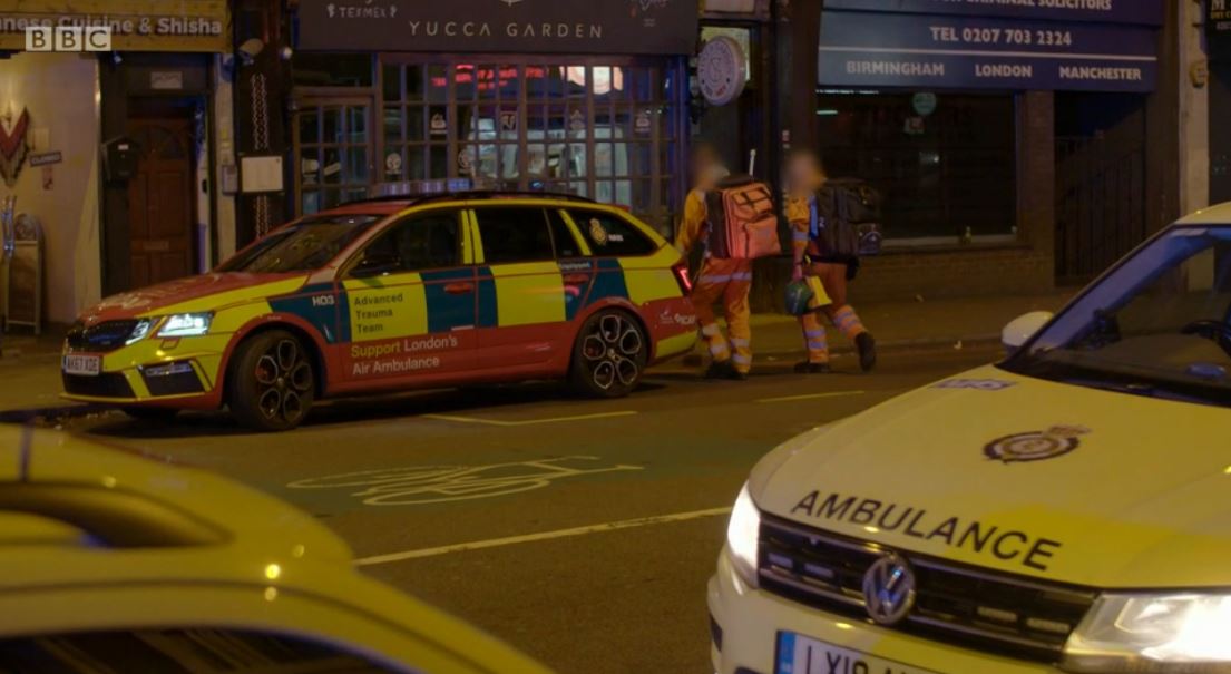 Paramedics on Ambulance getting back into their vehicle