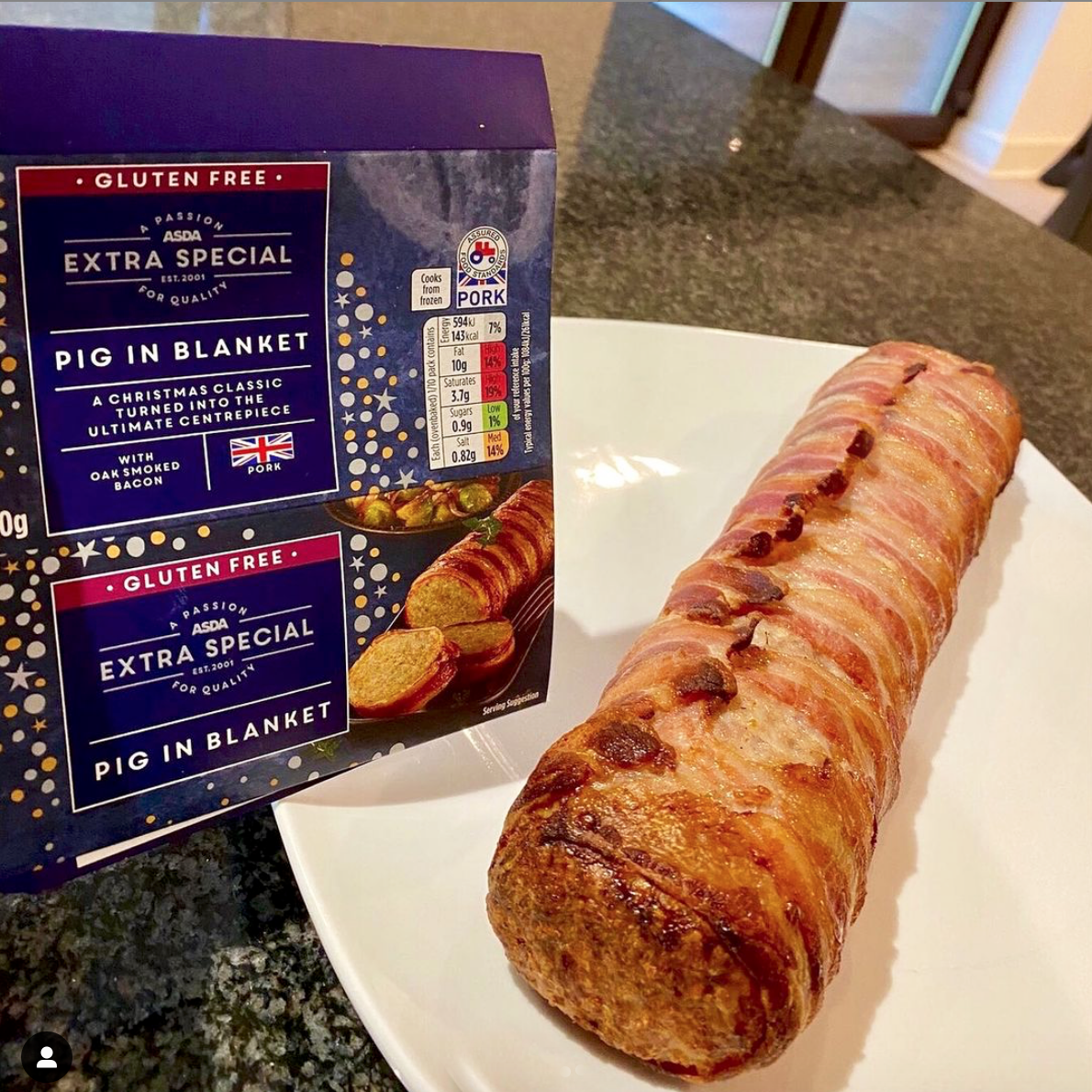 cooked giant pig in blanket on a plate