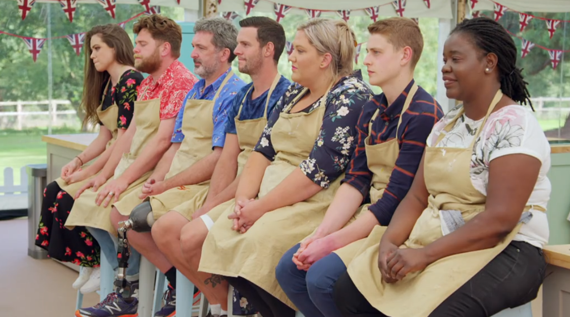 All the GBBO contestants sitting in a line