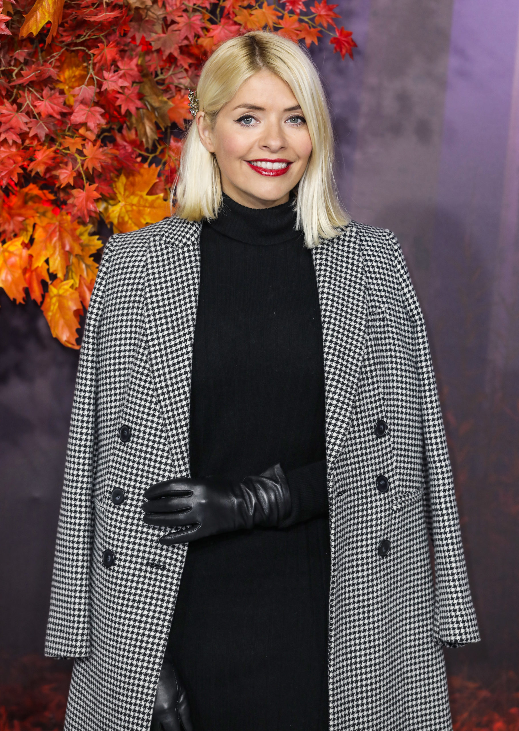 holly Willoughby posing in a coat