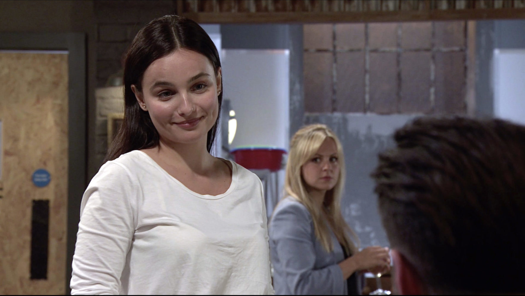 Sarah is not impressed when she sees Adam trying to chat up Alina in Coronation Street