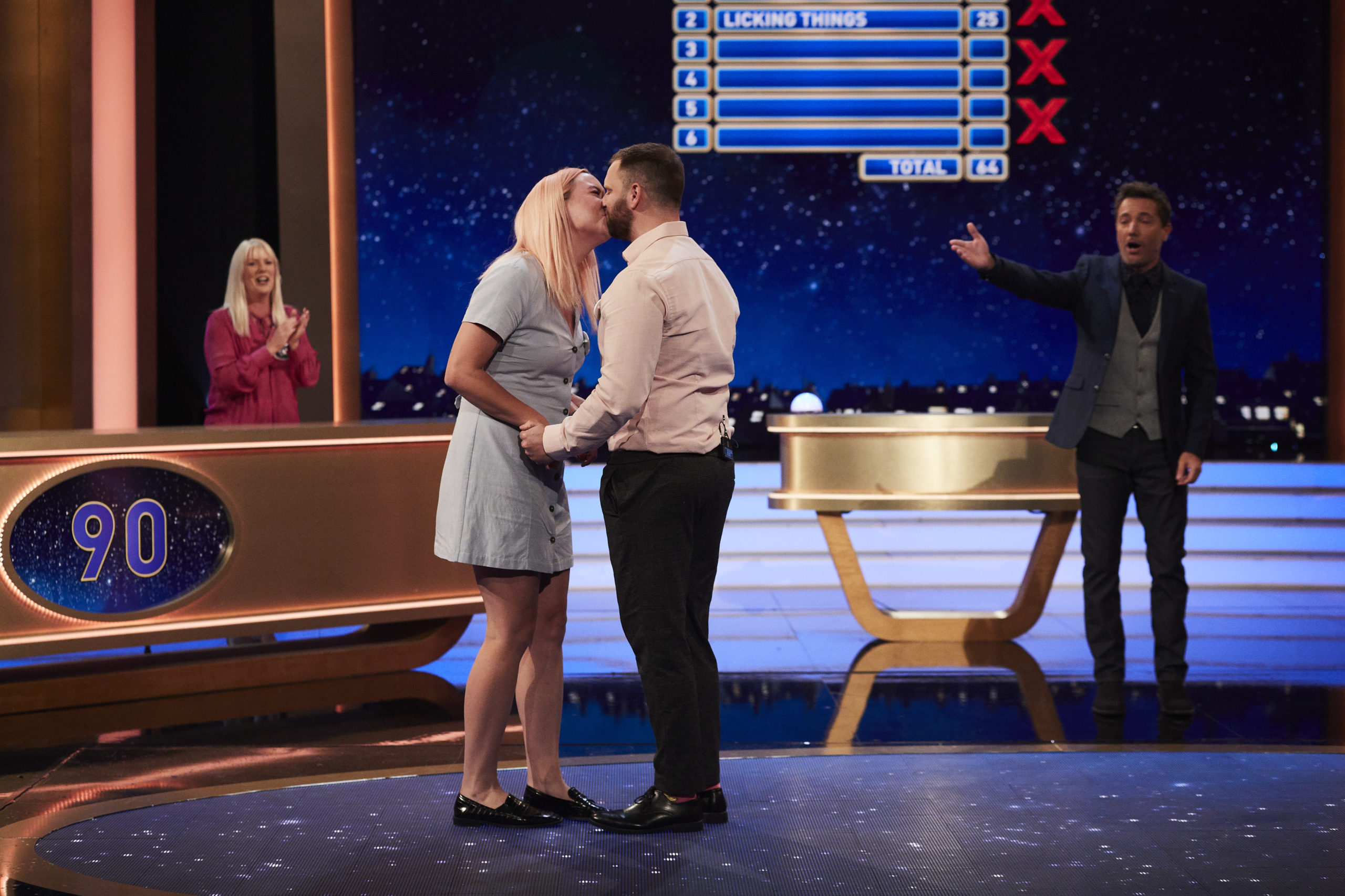 Liam kissing Nadine after proposing on Family Fortunes
