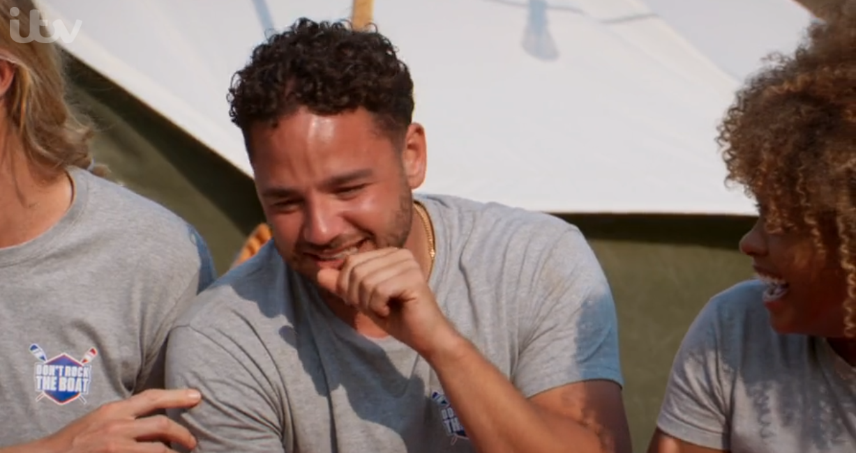 Adam Thomas covering his mouth on Don't Rock The Boat