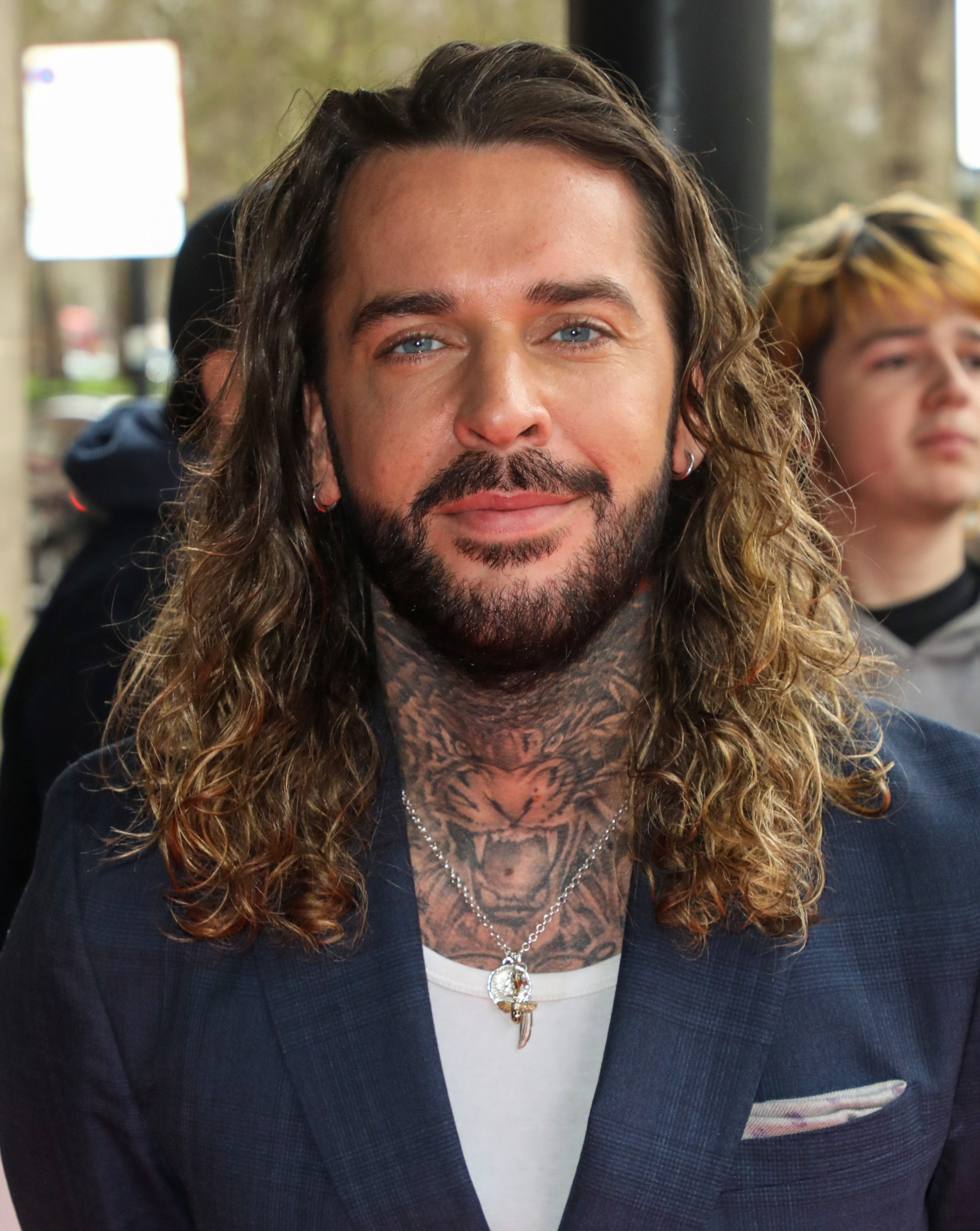 Pete wicks smiling at a party