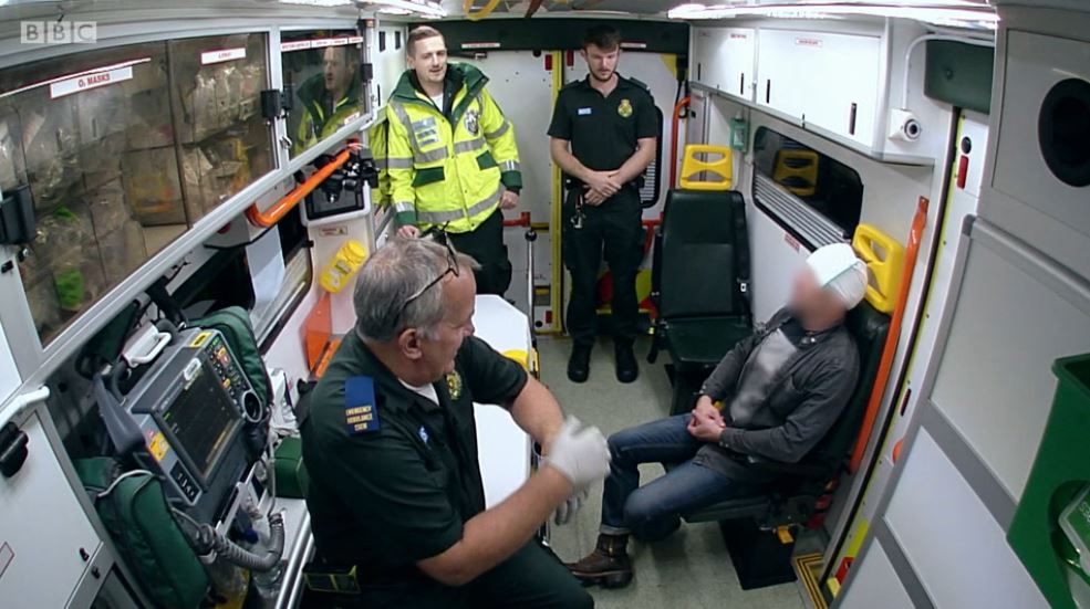 Paramedics treating the patient's head injury after Halloween joke went wrong