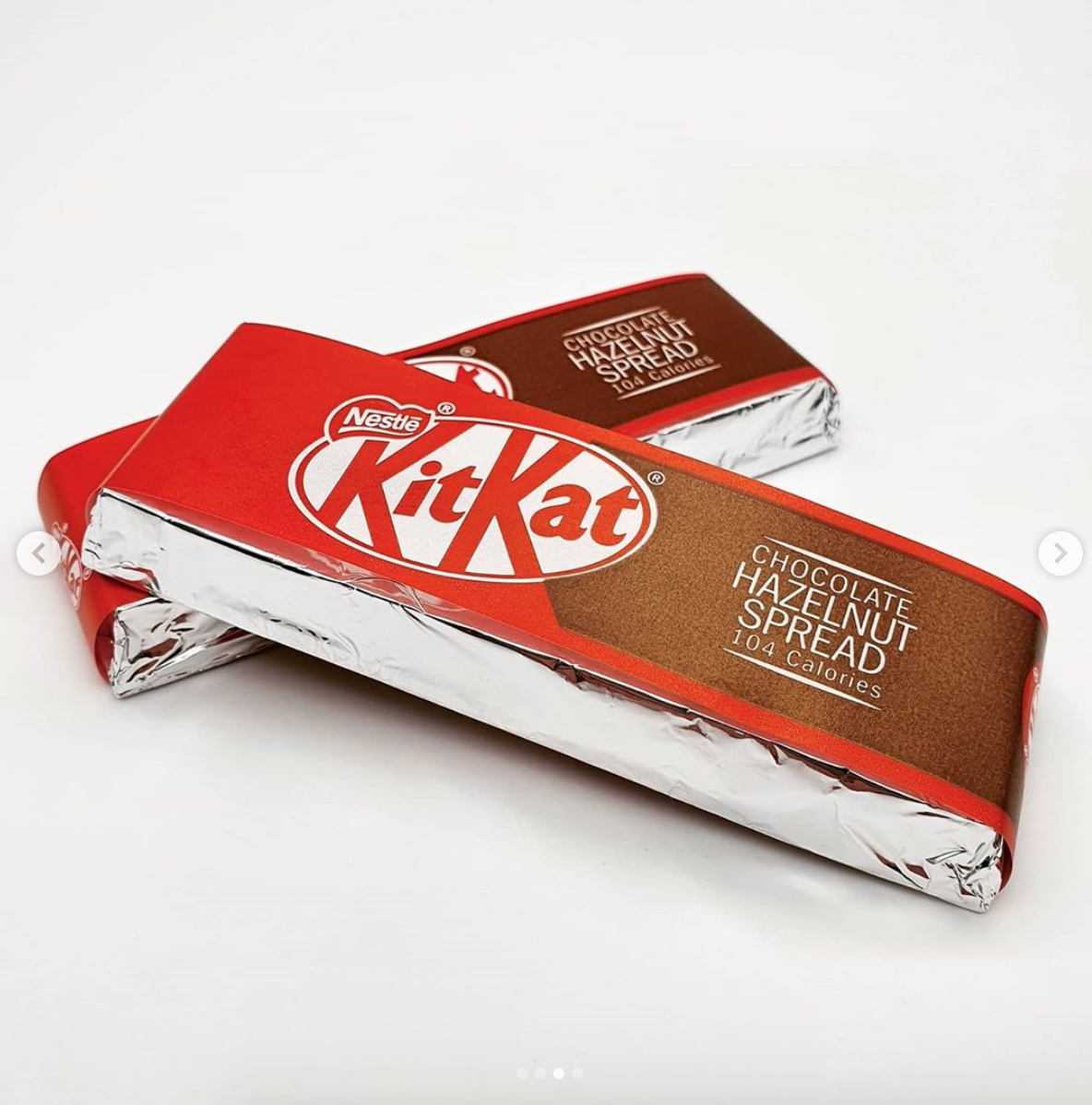 Two bars of wrapped KitKat Hazelnut Spread