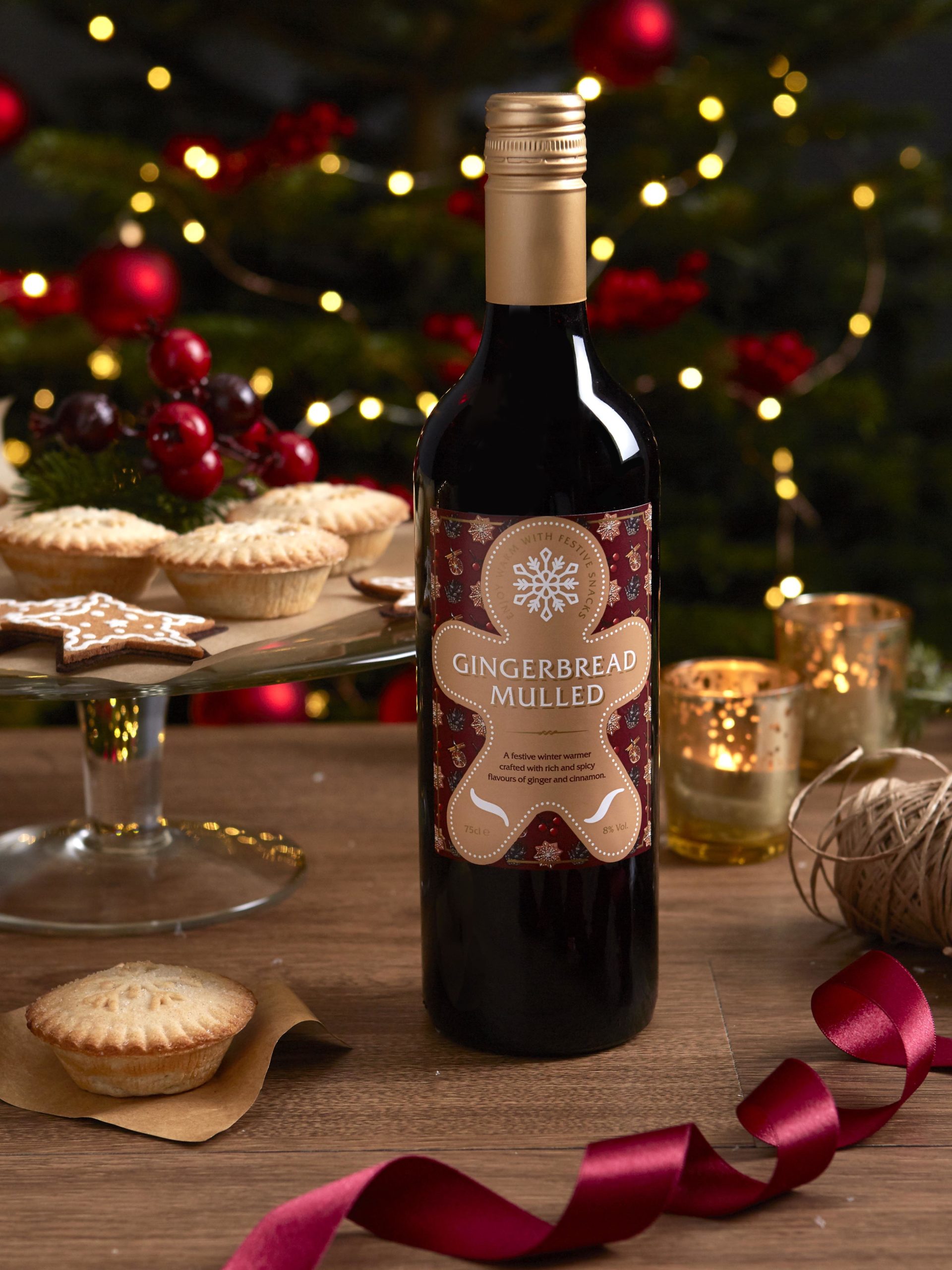 Christmas picture of some mulled wine by a sparkly tree