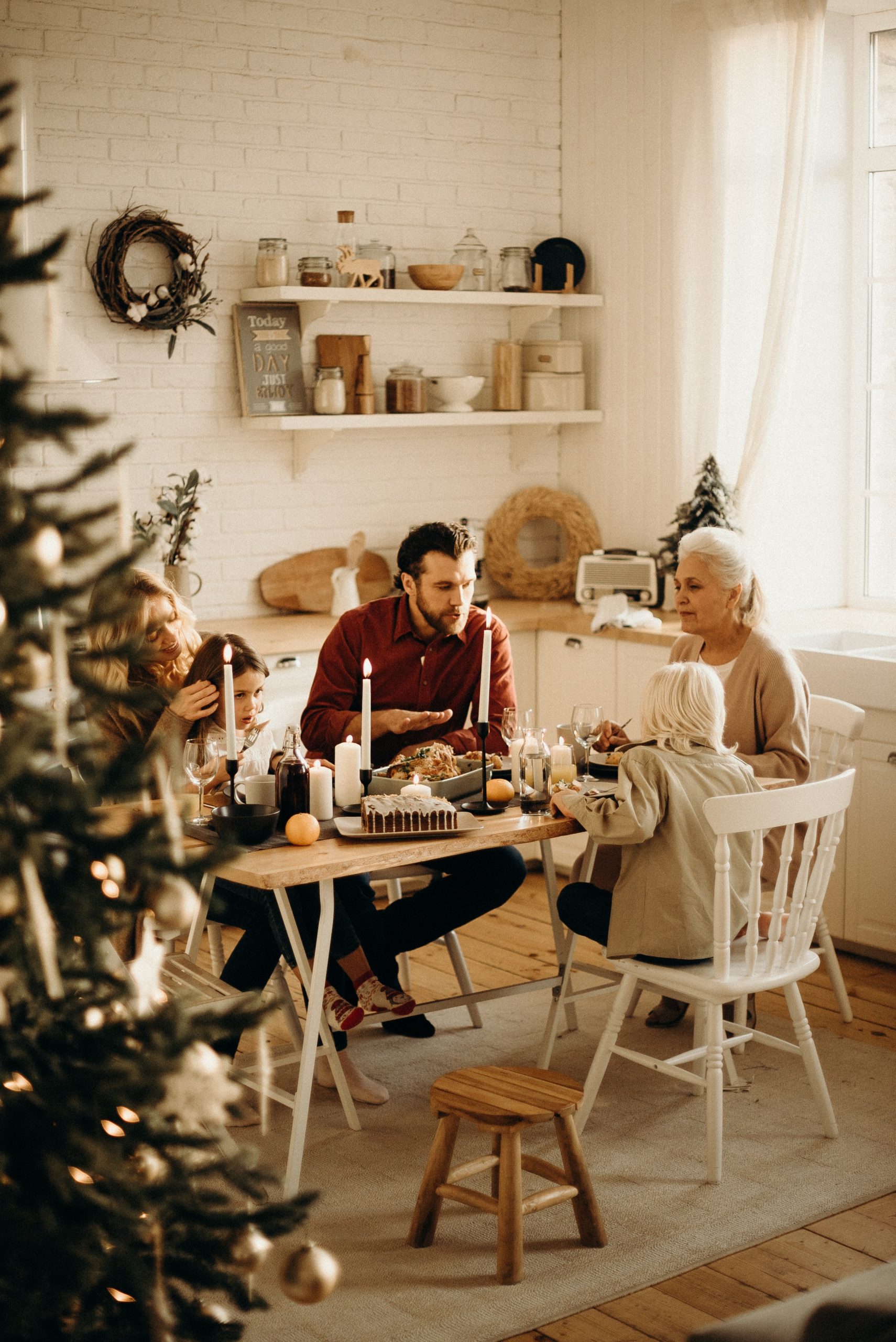 Small group of people sitting at a Christmas dinner table