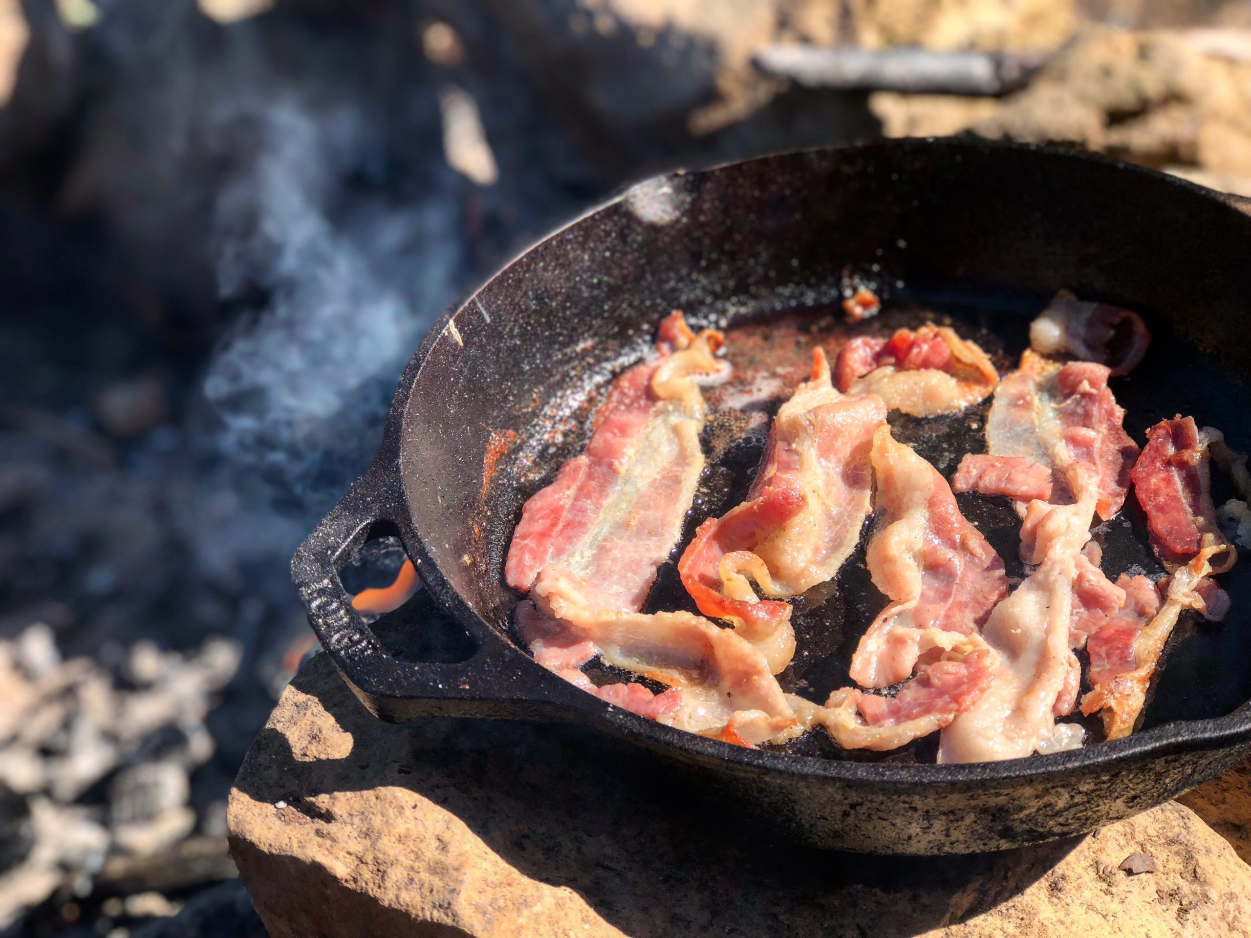 bacon frying in a pan