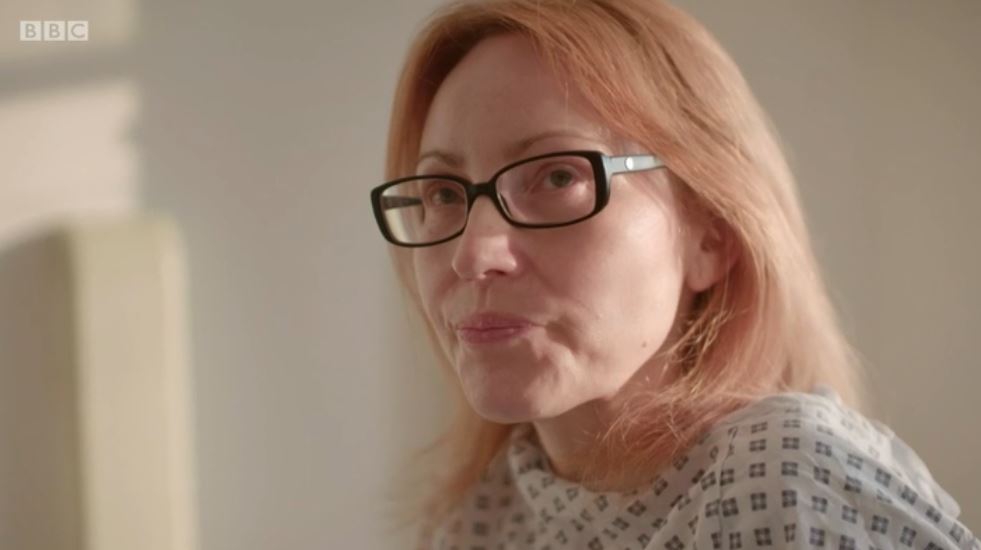 Judy in a hospital patient's gown