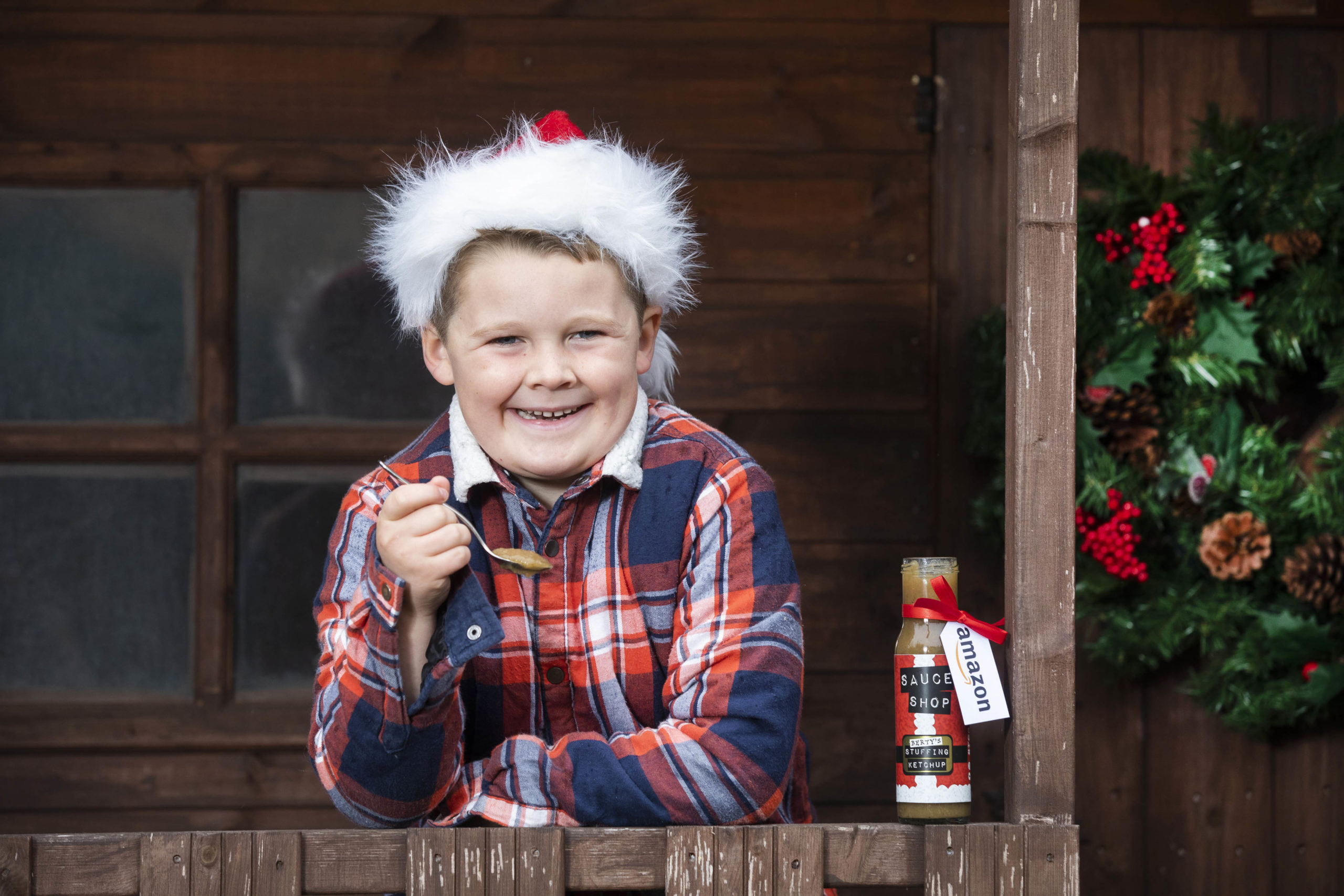 Little boy who created stuffing ketchup posing with his invention