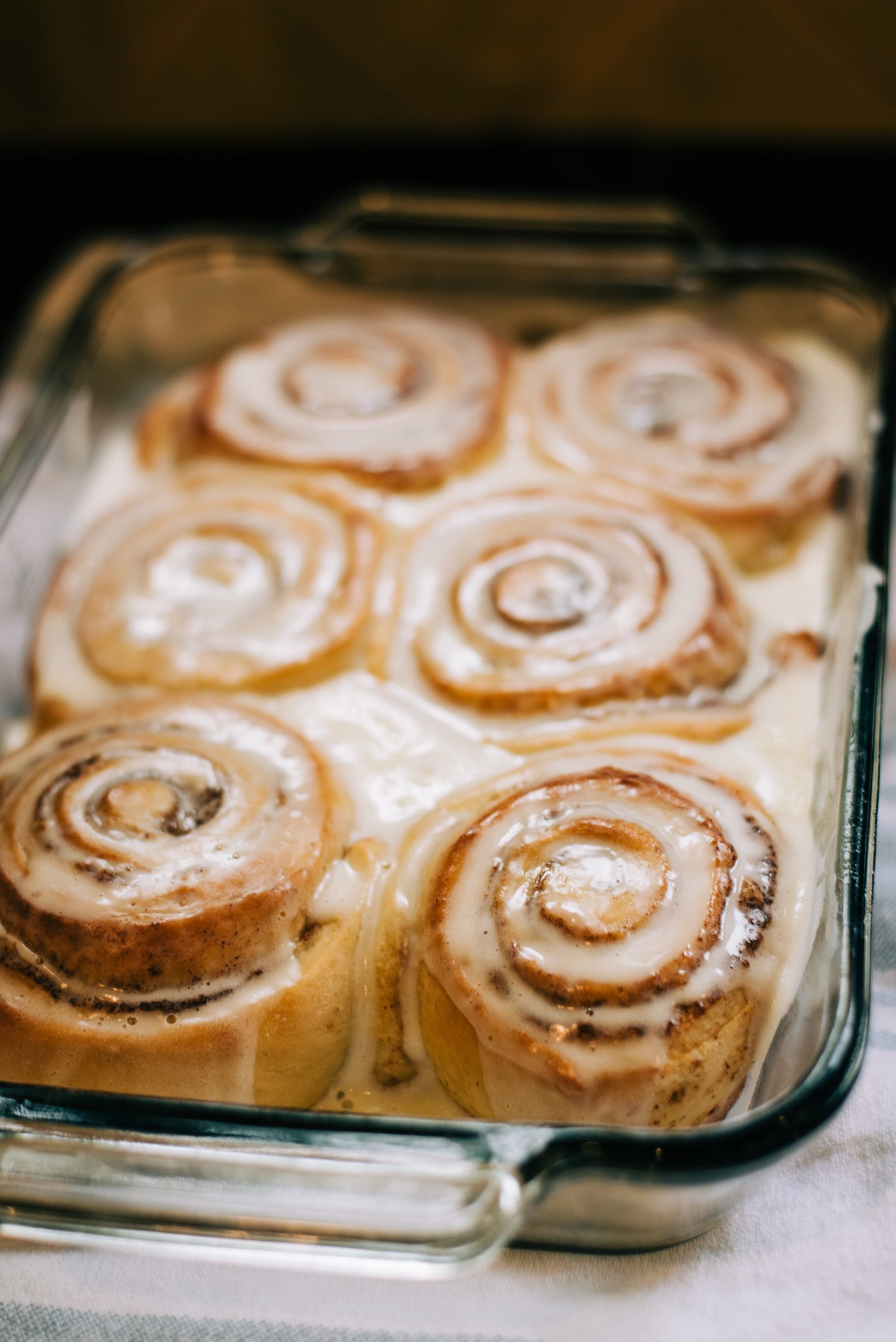 cinnamon buns covered in icing