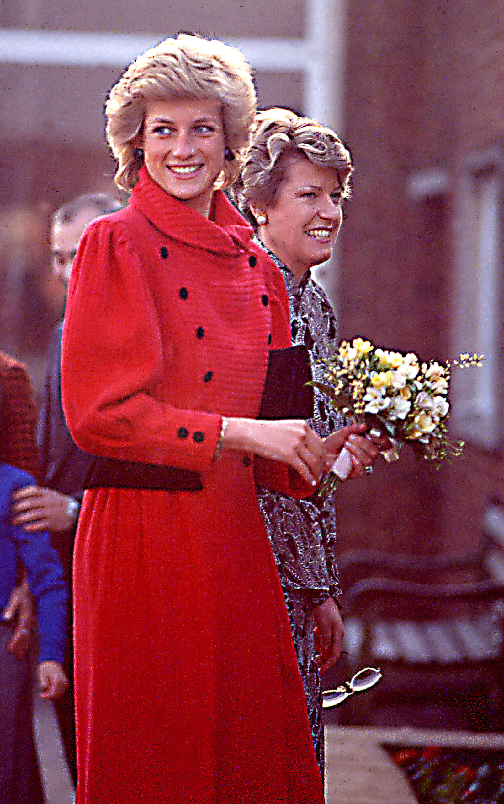 Princess Diana wearing a red coat