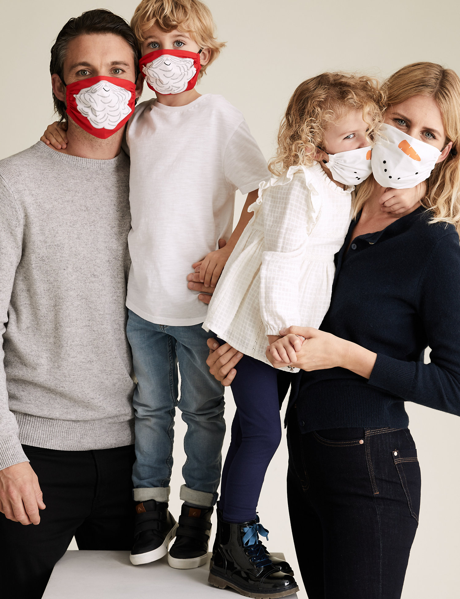 family wearing christmas face mask