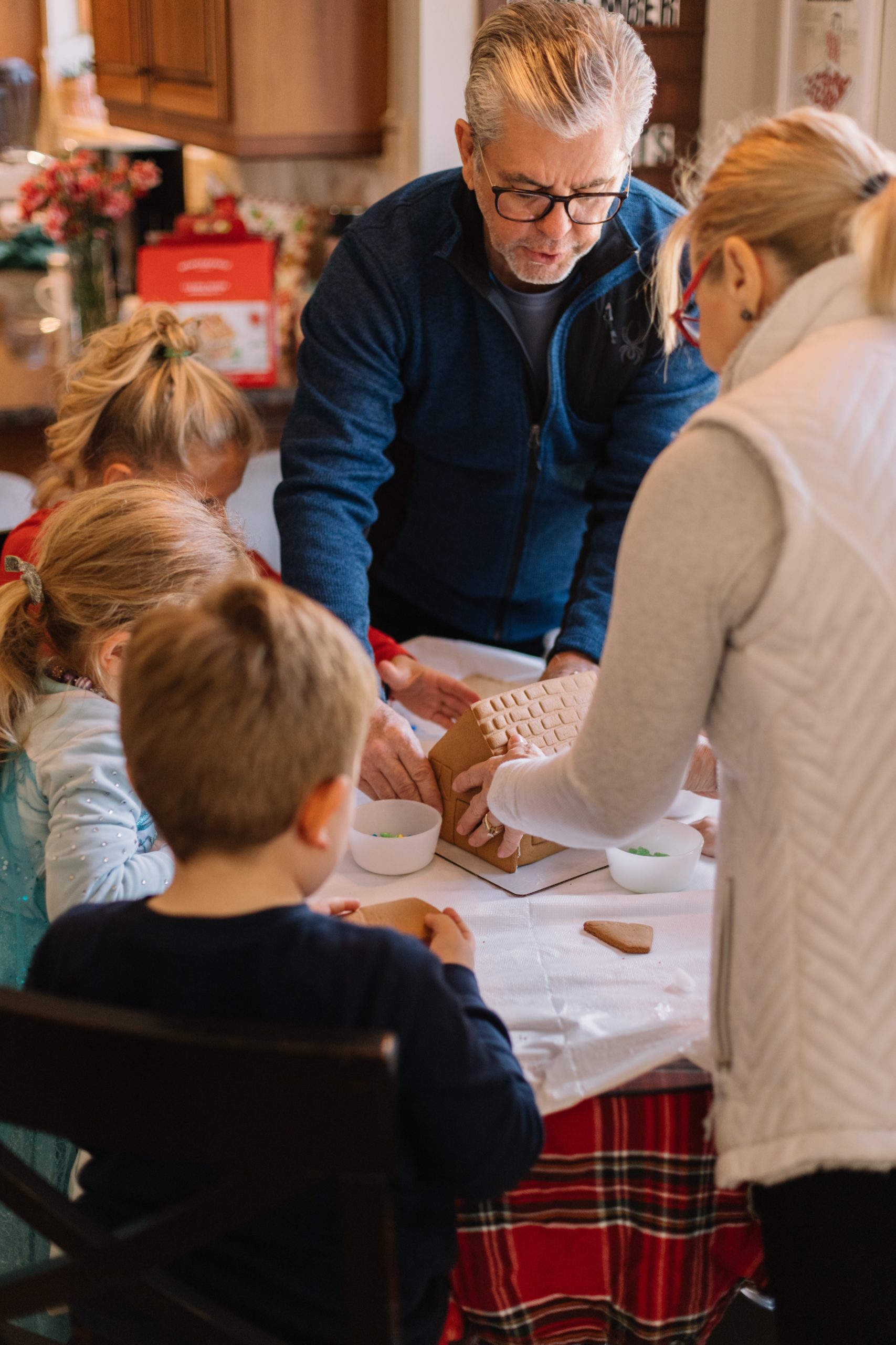 family making a gingerbread house