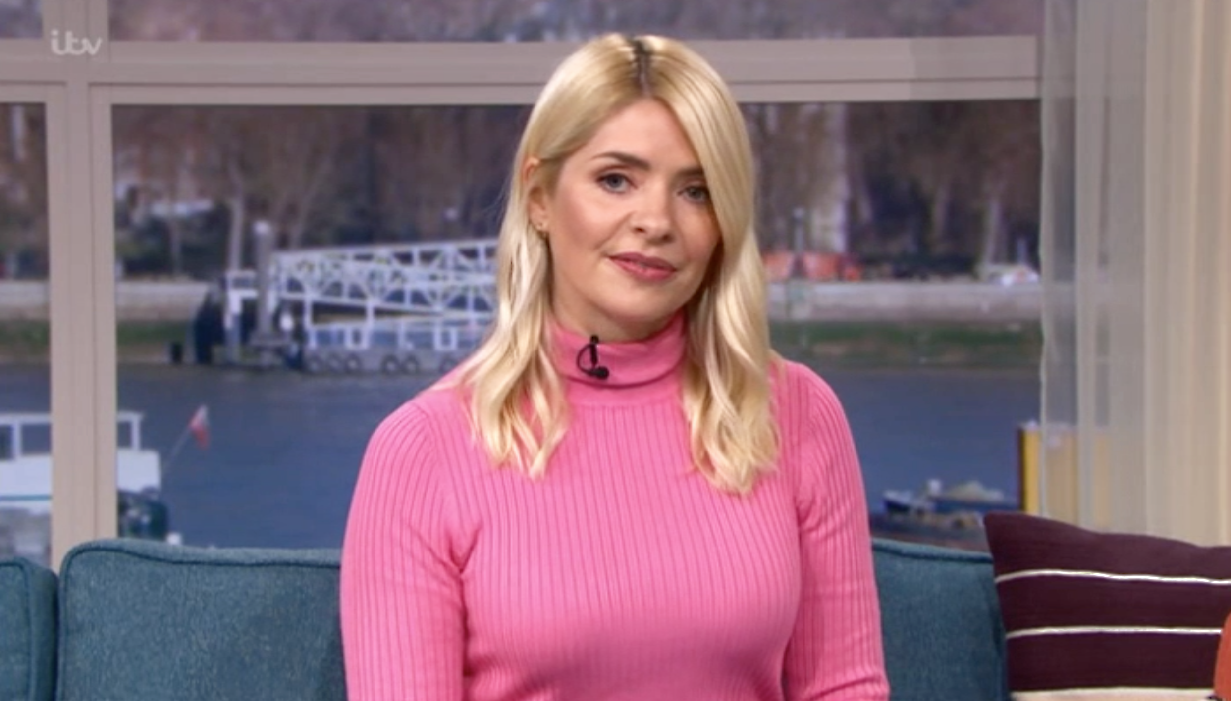 Holly Willoughby presenting This Morning in a pink jumper