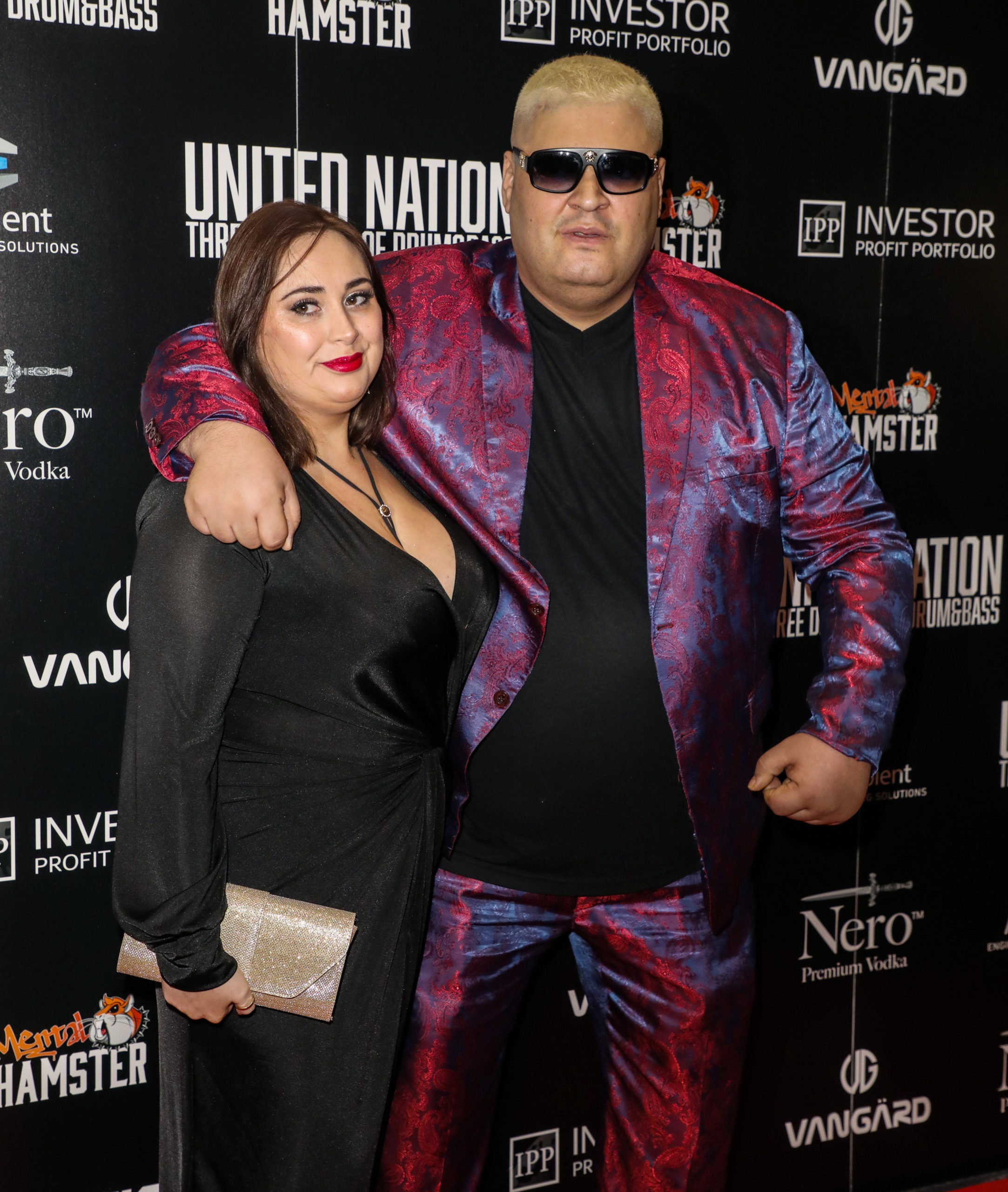 Heavy D, who was on Celebrity Big Brother, with his arm around a guest at an event